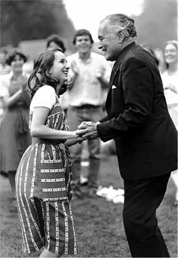 Fr. Hesburgh shaking hands with a young student